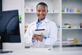 Black woman, tablet and pharmacist with checklist at counter for medicine stock, info and advice on drugs. Digital list Royalty Free Stock Photo