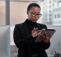 Black woman, tablet and working on creative project at startup, web designer with research and focus at office. Website Royalty Free Stock Photo
