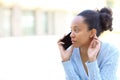 Black woman is talking on phone in the street Royalty Free Stock Photo