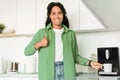 Black Woman With Thumbs Up Using Coffee Machine In Kitchen Royalty Free Stock Photo