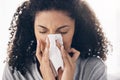 Black woman, tissue and sneeze of a sick young person blowing nose with toilet paper for safety. Flu, fever and cold of Royalty Free Stock Photo