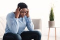 Black woman touching her head feeling stress Royalty Free Stock Photo