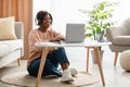 Black Woman Using Laptop Wearing Headphones Making Video Call Indoor Royalty Free Stock Photo