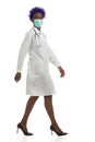 Black Woman Is Walking White Lab Coat And Protective Face Mask. Full Length, Isolated Royalty Free Stock Photo