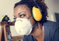 Black woman wearing ear protection in work area Royalty Free Stock Photo