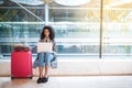 Black woman working with laptop at the airport waiting at the wi Royalty Free Stock Photo