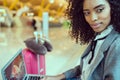 Black woman working with laptop at the airport waiting at the wi Royalty Free Stock Photo