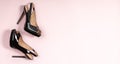 Black women high heel shoes on pink background. Flat lay, top view trendy beauty female background Royalty Free Stock Photo