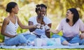 Black women, picnic and beer toast in park, nature environment or sustainability garden with food, popcorn or cotton