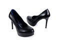 Black women`s high-heeled shoes on a white background Royalty Free Stock Photo