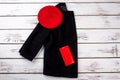 Black women`s jacket with red hat and wallet. Royalty Free Stock Photo