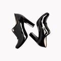 Black women`s leather shoes isolated on white background. Clipping path. Top view Royalty Free Stock Photo