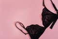 Black women underwear on pink background.