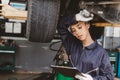 Black women worker staff hard working at the garage car checking feel hot and tired uncomfortable Royalty Free Stock Photo