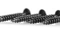 black wood screws on isolated white background Royalty Free Stock Photo