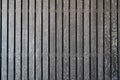 Black wooden battens with white scraping burrs. background texture interior design