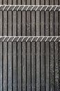 Black wooden battens with white  scraping burrs and rope installation detail. background texture interior design Royalty Free Stock Photo