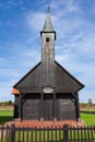 Black wooden church with small bell tower and black picket fence Royalty Free Stock Photo