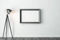 Black Wooden horizontal Frame Mockup hanging on gray wall with modern floor lamp