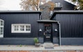 Black wooden house in tradition style of Copenhagen, Denmark. Historical city street