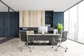 Black and wooden office room with chairs, table and computer with shelf