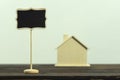 Black wooden sign And a simulated wooden house