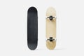 Black wooden skateboard mockup isolated on white background. Royalty Free Stock Photo