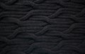 Black woolen cable knit pattern Royalty Free Stock Photo