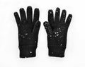 Black woolen gloves on snow Royalty Free Stock Photo