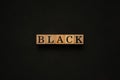 Black word on wooden block