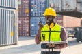 Black worker African working engineer foreman radio control in port cargo shipping customs container yard