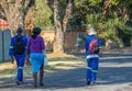 Black workers walk to their jobs in South Africa