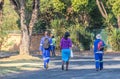 Black workers walk to their jobs in South Africa