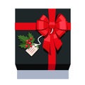 Black wrapped gift box decorated with red bow
