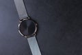 Wrist watch with metal strap for women on gray background Royalty Free Stock Photo