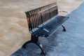 black wrought iron bench in the city outdoor
