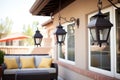 black wrought iron lanterns on a spanish patio