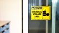 Black-yellow Chemical storage area Hazard Sign and symbol on the glass door, Caution for warning dangerous space in laboratory.