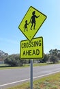 Black and yellow children crossing ahead sign