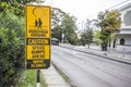 Black and yellow children crossing ahead sign