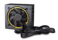 Black yellow computer atx format modular power supply with cables isolated white background. pc hardware component technology