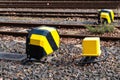 Black and yellow electrical controller boxes for railway switches. Royalty Free Stock Photo