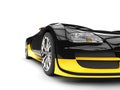 Black and yellow modern super sports car - headlight closeup shot