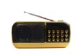 A black yellow portable radio receiver unit with retractable antenna white backdrop