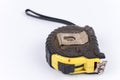 Black yellow tape measure isolated over white Royalty Free Stock Photo