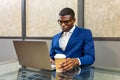Black young businessman working on laptop Royalty Free Stock Photo