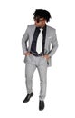 A black young man standing in a gray suit and sunglasses Royalty Free Stock Photo