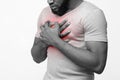 Black young man suffering from acid reflux or heartburn Royalty Free Stock Photo