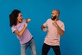 Black young man and woman laughing while dancing together Royalty Free Stock Photo