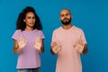 Black young man and woman making stop gesture at camera Royalty Free Stock Photo